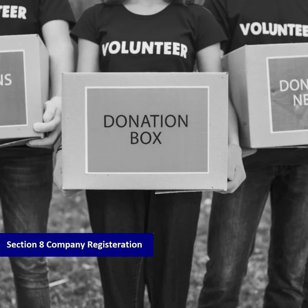 The black and white image shows three volunteers holding a donation box and the "Section 8 Company Registration" text on a blue background.